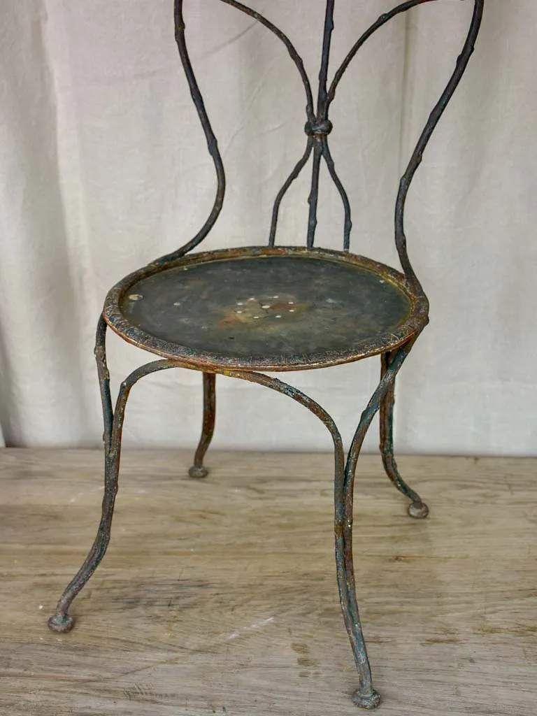 Antique French garden chair with branch - like back