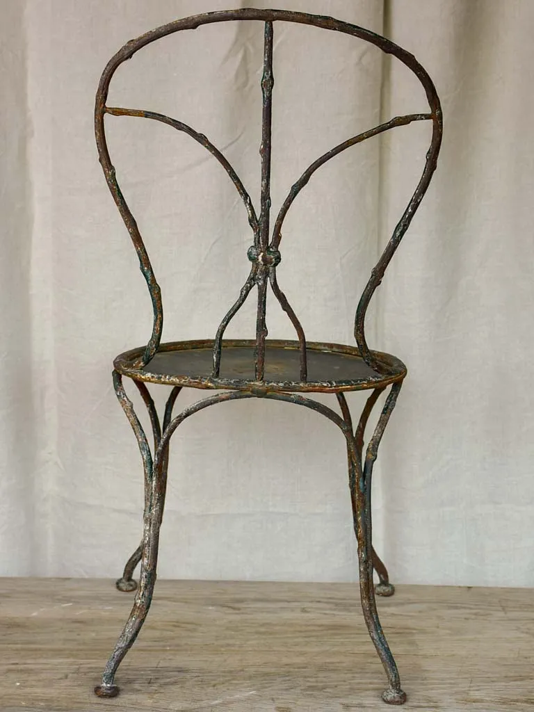 Antique French garden chair with branch - like back