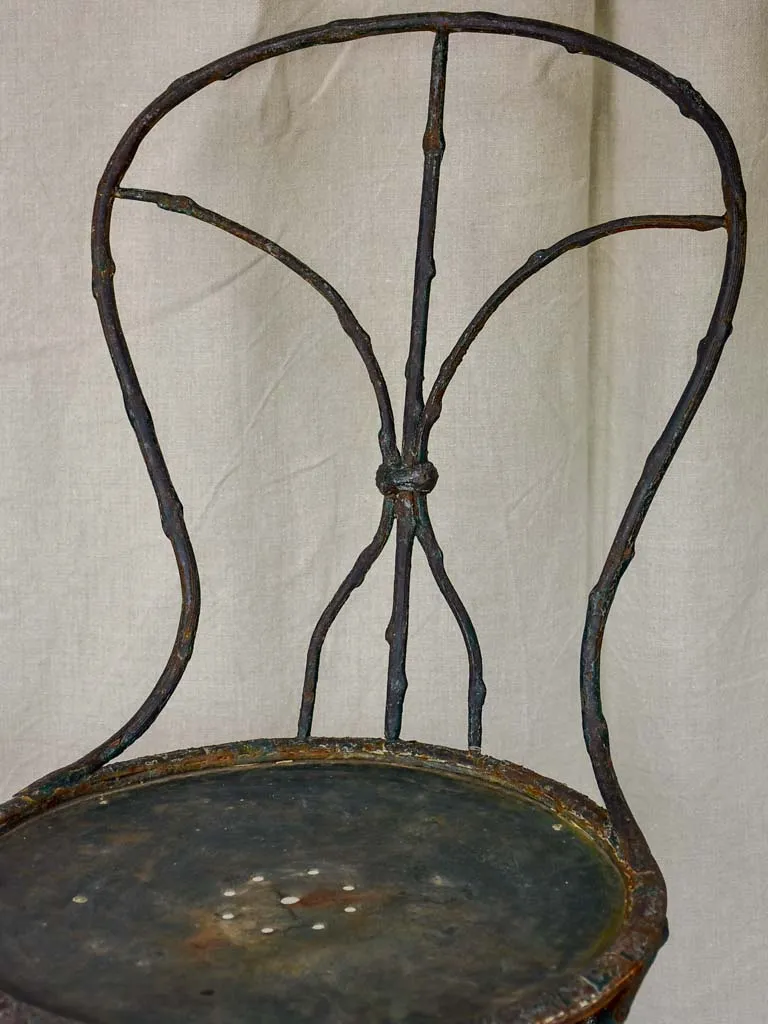 Antique French garden chair with branch - like back