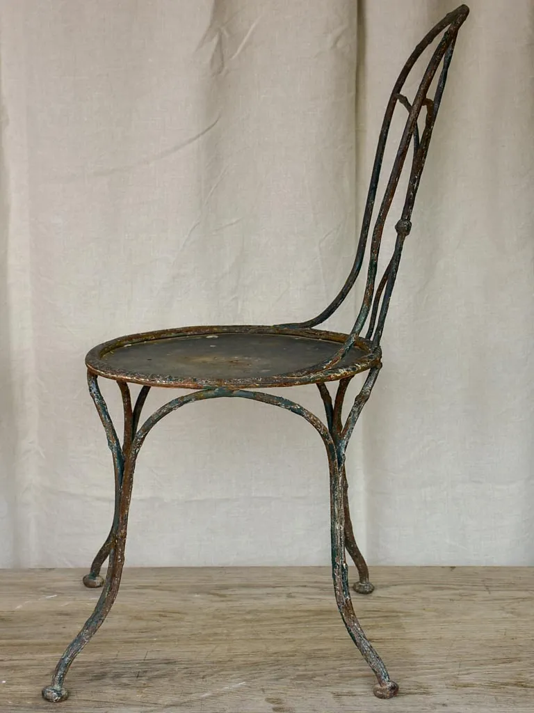 Antique French garden chair with branch - like back