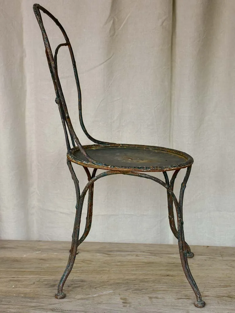 Antique French garden chair with branch - like back